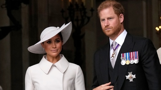 Prince Harry and Meghan Markle, Duke and Duchess of Sussex, leave after a service of thanksgiving for the reign of Queen Elizabeth II at St Paul's Cathedral in London, on June 3, 2022. (AP Photo/Matt Dunham, Pool)