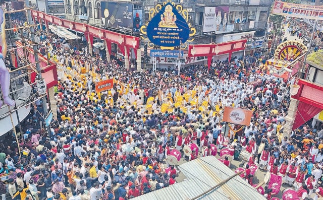After two years, the sound of drums and shouts of ‘Ganpati Bappa Morya’ echoed across the city as lakhs of people gathered at Laxmi road to witness Manache Ganpati procession and dhol tasha group performance on Wednesday. (Rahul Raut/HT PHOTO) After two years, the sound of drums and shouts of ‘Ganpati Bappa Morya’ echoed across the city as lakhs of people gathered at Laxmi road to witness Manache Ganpati procession and dhol tasha group performance on Wednesday. (Rahul Raut/HT PHOTO)