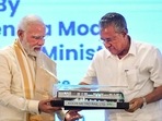 Prime Minister Minister Narendra Modi receives a memento from Kerala CM Pinarayi Vijayan at the inauguration of various projects in Kochi on Thursday. Prime Minister Minister Narendra Modi receives a memento from Kerala CM Pinarayi Vijayan at the inauguration of various projects in Kochi on Thursday.