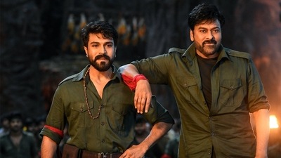 Chiranjeevi and Ram Charan in a still from their recent release Acharya. Chiranjeevi and Ram Charan in a still from their recent release Acharya.
