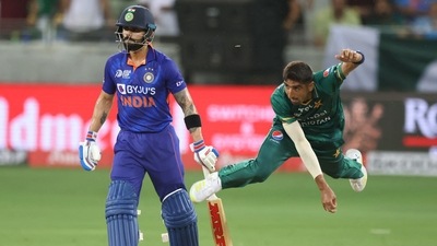 Shahnawaz Dahani delivers a ball as Virat Kohli watches from the non-striker's end during Asia Cup encounter in Dubai (AFP) Shahnawaz Dahani delivers a ball as Virat Kohli watches from the non-striker's end during Asia Cup encounter in Dubai (AFP)