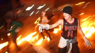 Men throwing gas soaked fireballs at each other.&nbsp; (REUTERS)