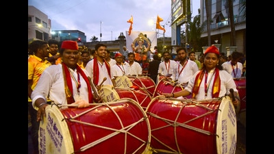 A dhol tasha group performs as the Ganpati idol is brought to the mandal (Photo: Vijay Bate/HT) A dhol tasha group performs as the Ganpati idol is brought to the mandal (Photo: Vijay Bate/HT)