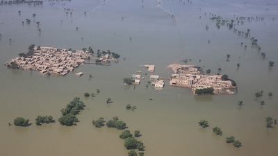 TOPSHOT - This aerial photograph taken on Thursday shows a flooded residential area after heavy monsoon rains in Dadu district of Sindh province in Pakistan. (AFP)