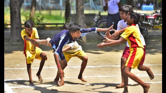 Players in action on the first day of block-level games under Punjab Khed Mela during the kabbadi match between IPS school and Government School Salem Tabri in School games at Guru Nanak Stadium Indoor stadium in Ludhiana. (Gurpreet Singh/HT)