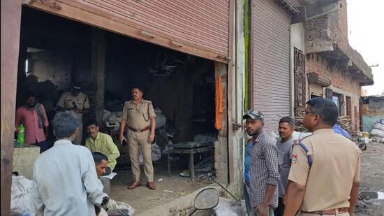 Police personnel check a godown of a scrap dealer under a special drive in Udham Singh Nagar to confirm if they have any hazardous material (HT Photo)
