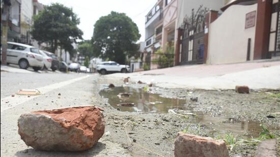 Ghaziabad, India - September 01 2022: Broken bricks seen near the building in Ashok Vihar Block A where stone pelting has been reported since the last three days, in Ghaziabad , India on Wednesday, September 01. 2022. (Photo by Sakib Ali /Hindustan Times)