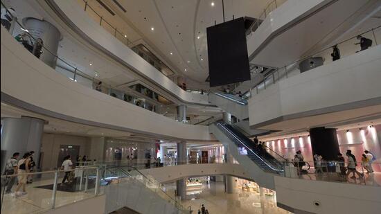 People visit a shopping mall in Chengdu, in China’s southwestern Sichuan province. (AFP/FILE)