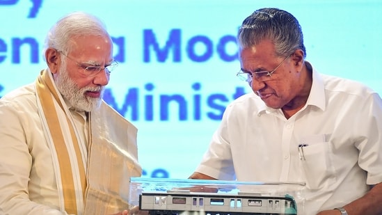 Prime Minister Minister Narendra Modi receives a memento from Kerala CM Pinarayi Vijayan at the inauguration of various projects in Kochi on Thursday.(PTI)