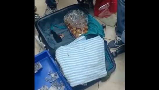 The image shows how a passenger stuffed foreign currency inside lehenga buttons. (Twitter/@CISFHQrs)
