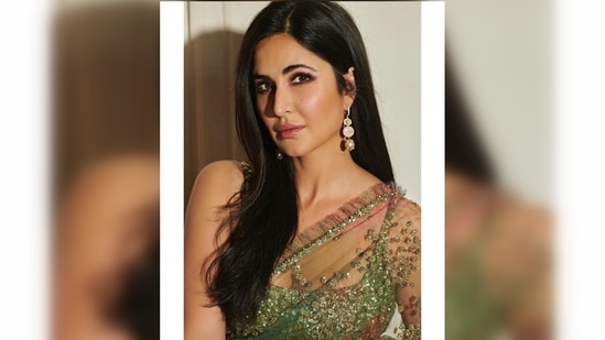 Katrina Kaif kept it traditional with a touch of contemporary and draped this green sheer saree teamed with a shimmery sleeveless blouse.(Instagram/@stylebyami)