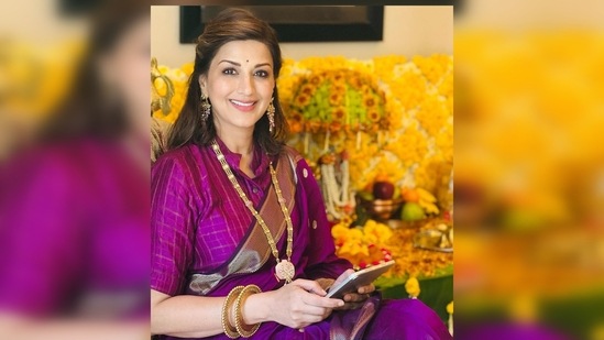 On day two of Ganesh Chaturthi, Sonali Bendre wore a gorgeous purple banarasi silk saree teamed with a textured blouse and gold jewellery.(Instagram/@sonalibendre)