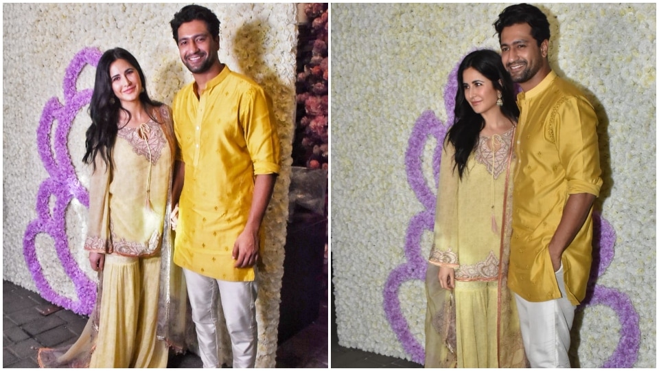 Vicky Kaushal and Katrina Kaif twinned in yellow as they posed for pictures together.(HT Photos/Varinder Chawla)