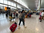 FILE - Travelers at Heathrow Airport in London. FILE - Travelers at Heathrow Airport in London.
