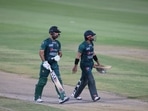 Mohammad Rizwan (R) and his teammate Khushdil Shah leave the field after Pakistan's innings during Asia Cup match against Hong Kong at the Sharjah Cricket Stadium(AFP)