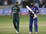 India's Hardik Pandya, right, interacts with Pakistan's Haris Rauf after India won the Asia Cup match against Pakistan.