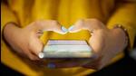 Young woman using cell phone to send text message on social network at night. Closeup of hands with computer laptop in background (Getty Images/iStockphoto) Young woman using cell phone to send text message on social network at night. Closeup of hands with computer laptop in background (Getty Images/iStockphoto)
