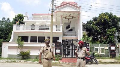 The police investigating at the spot after man, his son open fire at their neighbour over dog poop in Sector 32-A, Chandigarh Road, in Ludhiana on Friday. (Harvinder Singh/HT)