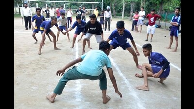 Players in action during the kabaddi match being played under Punjab Khed Mela at Guru Nanak Stadium in Ludhiana. (Harvinder Singh/HT)