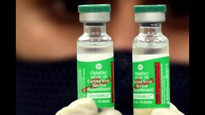 A medic shows vial containing doses of Covishield vaccine (PTI) A medic shows vial containing doses of Covishield vaccine (PTI)