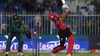 Hong Kong's Ayush Shukla (R) is bowled out by Pakistan's Shadab Khan (not pictured) during the Asia Cup Twenty20 Hong Kong's Ayush Shukla (R) is bowled out by Pakistan's Shadab Khan (not pictured) during the Asia Cup Twenty20