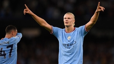 Manchester City's Norwegian striker Erling Haaland celebrates after scoring (AFP)