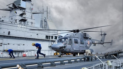 Navy helicopter takes off from the flight deck of INS Vikrant. (PTI) Navy helicopter takes off from the flight deck of INS Vikrant. (PTI)