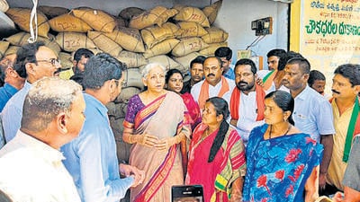 Union finance minister Nirmala Sitharaman on Friday stopped at a fair price shop at Birkur village and interacted with the beneficiaries of the PM Garib Kalyan Anna Yojana, under which each family would get five kg of rice free of cost. (ANI)