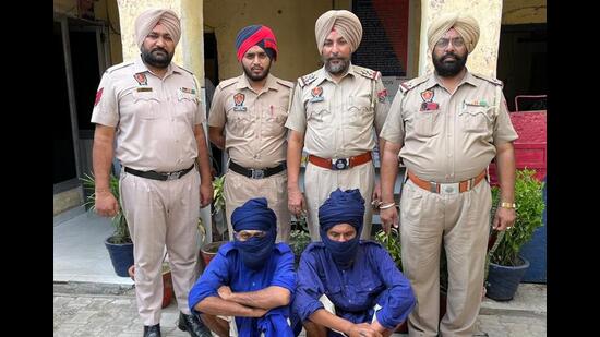 The murder accused in the custody of the Doraha police in Ludhiana on Friday. The accused are also Nihangs and they were living with the victim in a makeshift camp in Doraha. (HT Photo)