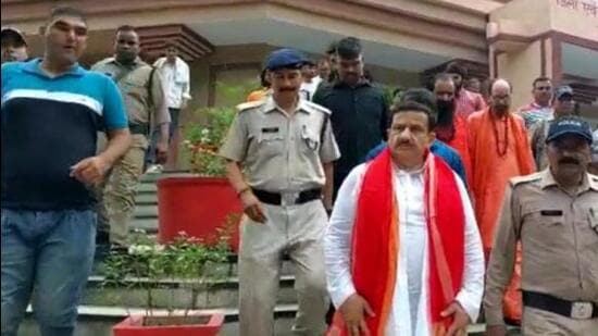 Jitendra Tyagi, alias Wasim Rizvi, (in white kurta) after his surrender. (HT Photo) Jitendra Tyagi, alias Wasim Rizvi, (in white kurta) after his surrender. (HT Photo)