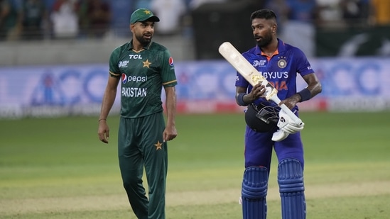 India's Hardik Pandya, right, interacts with Pakistan's Haris Rauf after India won the Asia Cup match against Pakistan.(AP)