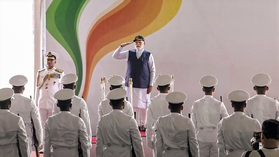 Prime Minister Narendra Modi receives a Guard of Honour as he arrives for the commissioning ceremony of the first indigenously designed and built aircraft carrier, INS Vikrant, at Cochin Shipyard Limited in Kochi.(PTI)