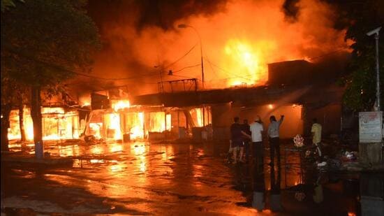 The blaze at the Sector 9 rehri market in Panchkula on Thursday night. At least 148 shops were gutted though there was no casualty. (Sant Arora/HT)