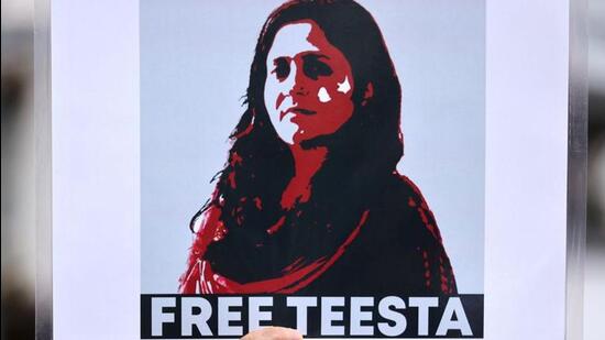 A protestor holds a placard demanding the release of activist Teesta Setalvad after she was arrested at her home by the anti-terrorism wing of the Gujarat police during a protest in Mumbai (Reuters File Photo) A protestor holds a placard demanding the release of activist Teesta Setalvad after she was arrested at her home by the anti-terrorism wing of the Gujarat police during a protest in Mumbai (Reuters File Photo)