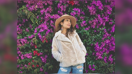 Fatima Sana Shaikh clicked an aesthetic picture of herself posing in front of a beautiful bougainvillea tree with pretty pink flowers.(Instagram/@fatimasanashaikh)
