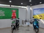 Electric scooters parked at a showroom in Kerala's Malappuram.