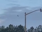 A small airplane circles over Tupelo, Miss., on Saturday. Police say the pilot of the small airplane is threatening to crash the aircraft into a Walmart store.&nbsp;