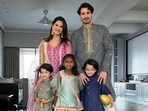 Sunny and her husband Daniel Weber posing with their kids ahead of the puja. The couple is parents to Nisha, Noah and Asher.