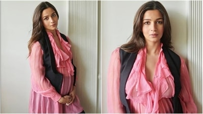 Mom-to-be Alia Bhatt flaunts baby bump in pink sheer ruffle dress. During pregnancy one should choose easy breezy and light fabrics just like Alia's outfit. She smartly matched it with a black waistcoat and a pair of black jeggings. For all the expectant mums out there, her style is a great inspiration. (Instagram/@aliaabhatt)