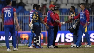 Sri Lanka's Chamika Karunaratne, second right, Wanindu Hasaranga, second left, shake hand with Afghanistan's players (AP) Sri Lanka's Chamika Karunaratne, second right, Wanindu Hasaranga, second left, shake hand with Afghanistan's players (AP)