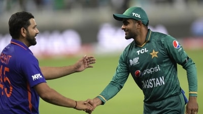 Pakistan's captain Babar Azam, right, shake hands with India's captain Rohit Sharma (AP) Pakistan's captain Babar Azam, right, shake hands with India's captain Rohit Sharma (AP)