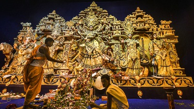 A Hindu priest performs rituals before the idol of Goddess Durga at a community pandal. (PTI Photo/Swapan Mahapatra) A Hindu priest performs rituals before the idol of Goddess Durga at a community pandal. (PTI Photo/Swapan Mahapatra)