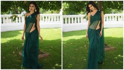 Today, Mouni dropped pictures of herself dressed in a green saree and a stylish blouse on Instagram. The Brahmastra actor wore the six yards for promoting the film and captioned the post, "Brahamastra promotions." Her bespoke look is from the shelves of the clothing label Mala and Kinnary India. Keep scrolling to see all photos. (Instagram)