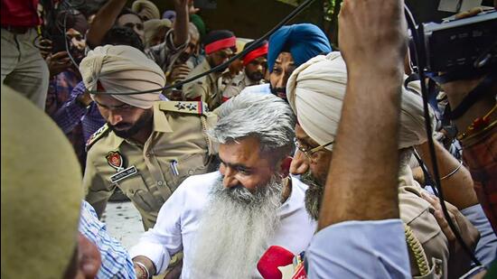 Congress leader Bharat Bhushan Ashu comes out after appearing before a court in an alleged food grain transportation tenders scam in Ludhiana. (PTI)