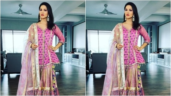 Sunny teamed her kurta with a pink and golden gharara set with golden zari details at the ankles. Sunny added more festive vives to her look with a pastel pink dupatta featuring golden zari details at the borders.(Instagram/@sunnyleone)