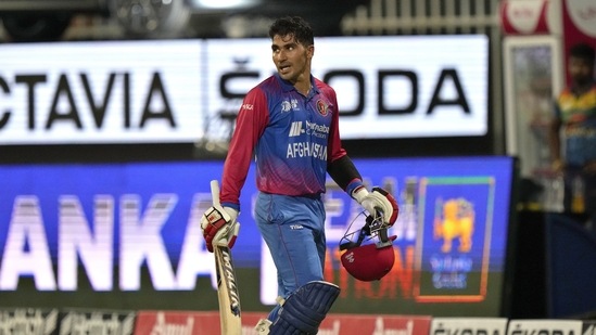 Afghanistan's Rahmanullah Gurbaz walks off the field after his dismissal during the T20 cricket match of Asia Cup between Sri Lanka and Afghanistan(AP)