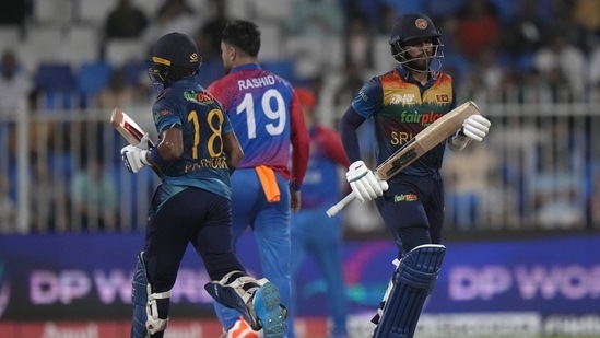Sri Lanka's Kusal Mendis, right, and Pathum Nissanka run between the wickets during the T20 cricket match of Asia Cup between Sri Lanka and Afghanistan(AP)