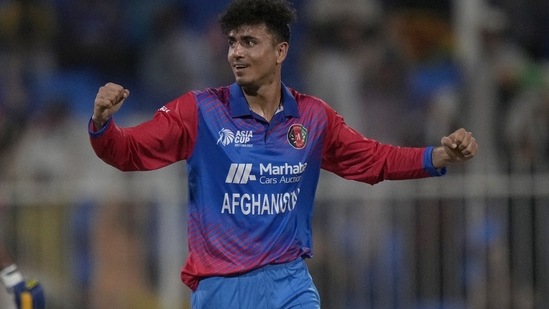 Afghanistan's Mujeeb Ur Rahman celebrates after taking the wicket of Dasun Shanaka during the T20 cricket match of Asia Cup between Sri Lanka and Afghanistan(AP)