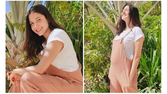 Anushka Sharma's effortless style and minimal aesthetics looks glamorous. The orange jumpsuit with a white tea underneath looks stunning. The loose fit of the jumpsuit makes it an ideal maternal wear. She paired it with white canvas shoes that give a sporty look.&nbsp;(Instagram/@anushkasharma)