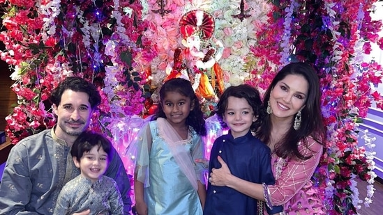 Sunny with her family with Lord Ganesha. 